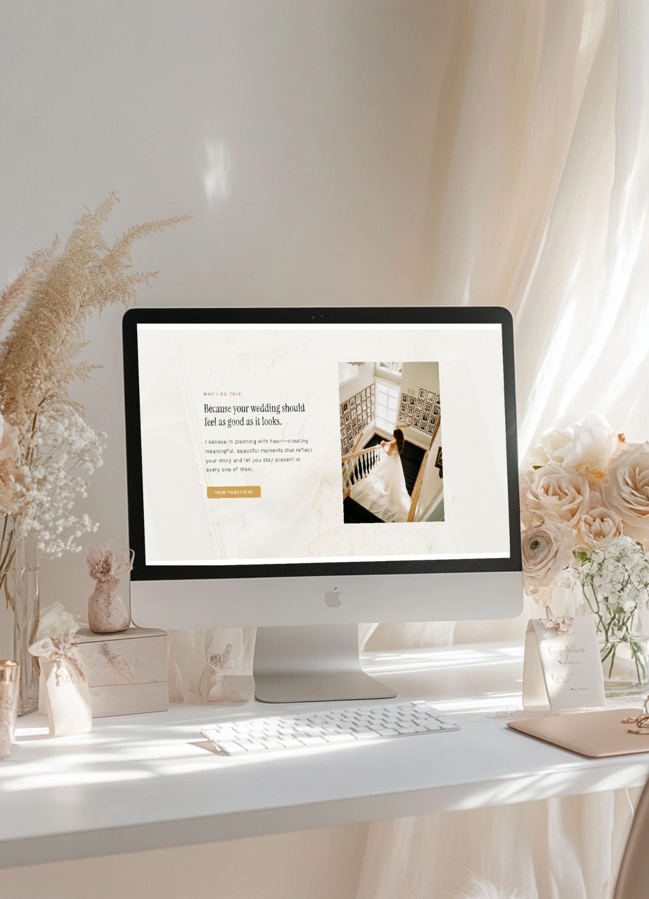A computer on a bright desk displaying a luxury wedding vendor website design tailored to attract ideal clients, featuring elegant branding and client-focused visuals.
